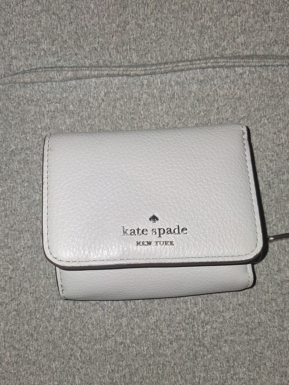 kate spade White Pebbled Leather Compact Wallet with Silver Logo